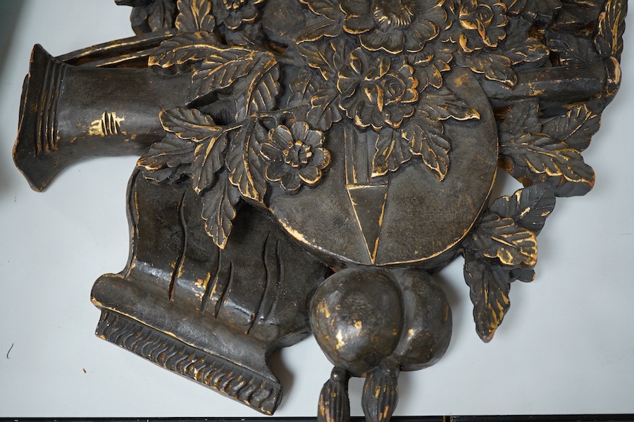 A folk art partially gilt carved panel, 50cm high